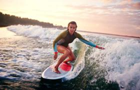 Which female surfer has the most world titles?